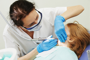dentist providing care to child