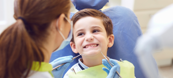 little boy getting a teeth check up
