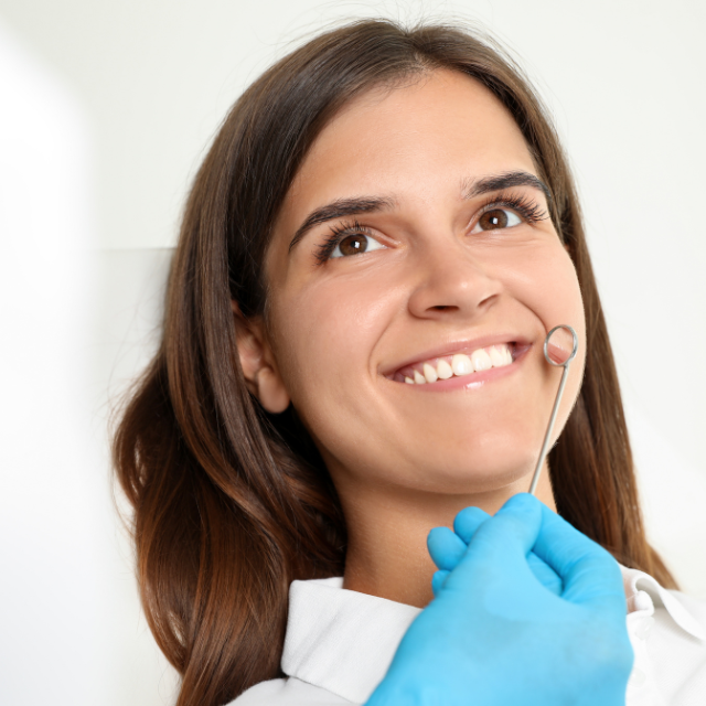 woman receiving cosmetic dentist treatment